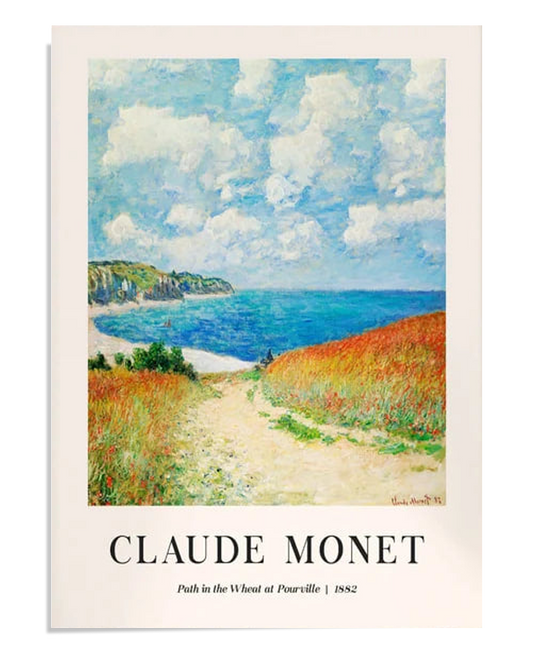 A bright landscape of a wheat field with a path leading to the sea. The cliffs in the distance meet the blue water, and the sky is filled with fluffy white clouds. The golden wheat adds warmth to this coastal scene.