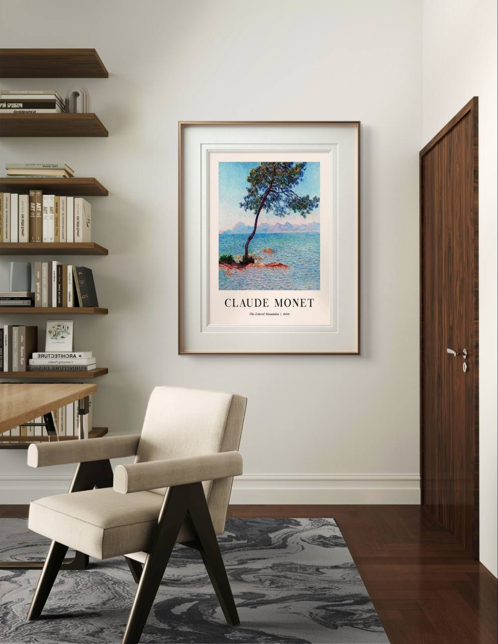 The framed painting is displayed in a minimalist room with modern furniture and bookshelves. Soft sunlight shines on the artwork, enhancing the calm blues of the sea and sky.