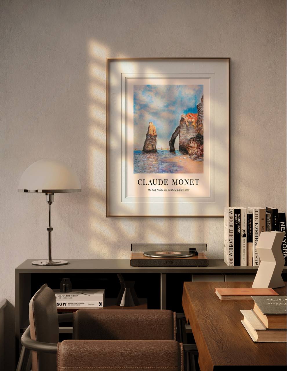 The framed painting features the rocky seaside cliffs of Étretat, with the Rock Needle and the natural arch as central figures. The warm tones of the sea and sky create a harmonious display in the room's calming environment.