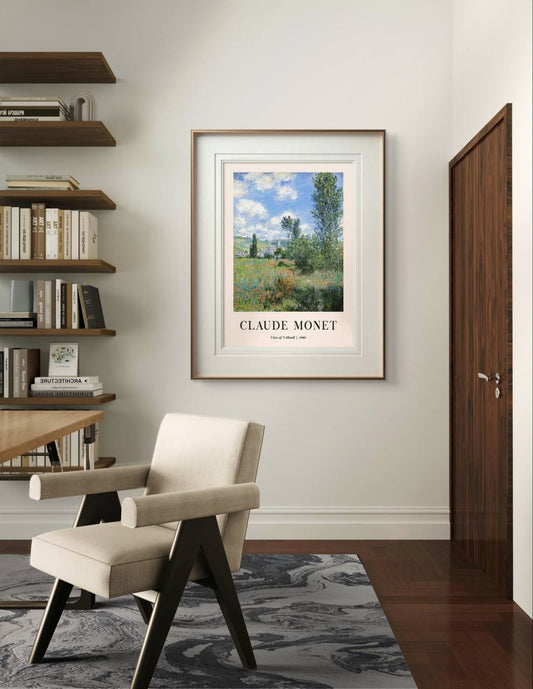 The framed painting, with its bright colors and calming scene of trees and fields, adds a peaceful touch to a modern room with minimalist decor.