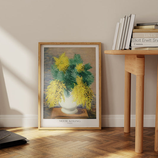 This Moise Kisling "Mimosa" poster, beautifully framed and placed against a neutral wall, showcases a vibrant bouquet of yellow mimosa flowers in a white vase. The delicate details and soft colors bring a touch of nature indoors, making it a perfect piece of wall art for any room. Ideal for those looking to add a fresh, floral accent to their home decor or as a thoughtful gift for art lovers.