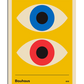 A Bauhaus-inspired poster with a yellow background featuring two large stylized eyes. The top eye has a blue iris with a black pupil, while the bottom eye has a red iris with a black pupil. The eyes are symmetrically aligned, creating a balanced composition. At the bottom, there is a black horizontal line with the word "Bauhaus" on the left and "1919" on the right.