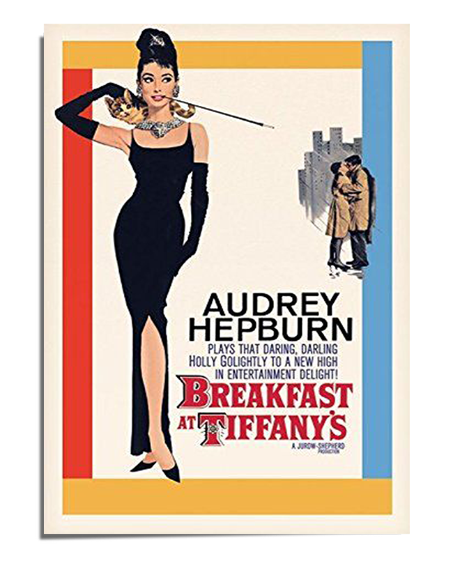 A vintage movie poster featuring Audrey Hepburn as Holly Golightly in the classic film Breakfast at Tiffany’s. She is dressed in a sleek black evening gown, wearing long black gloves, a pearl necklace, and holding a long cigarette holder. To the right, a smaller illustration of a couple in a romantic embrace is set against a cityscape background. The typography includes Audrey Hepburn’s name in bold black letters and the movie title in a distinctive red and white font. The edges of the poster have blue and