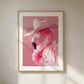 An art print showing a pink flamingo wearing a light pink cowboy hat. The background is a matching soft pink, creating a bold and stylish pop art look with a humorous twist.