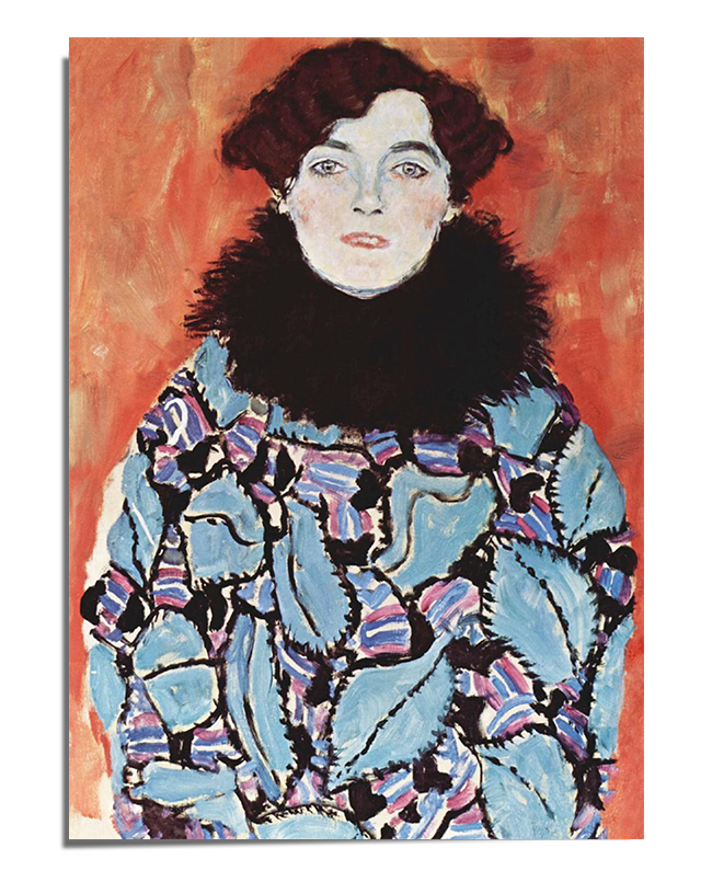 A painted portrait of a woman with short brown curls and striking blue eyes. She wears a richly decorated teal and violet garment, adorned with an intricate swirling pattern, and a black feather collar around her neck. Her pale skin contrasts against the warm, vibrant orange background, enhancing the depth and intensity of the composition.