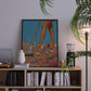 Framed artwork of legs in high heels on a bookshelf with decor items.
