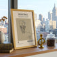 Framed basketball poster on a windowsill with cityscape view