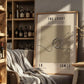 Framed poster with basketball design and text on a shelf with bottles and decor.