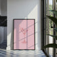 Framed artwork of a cocktail on a pink background in a modern kitchen.