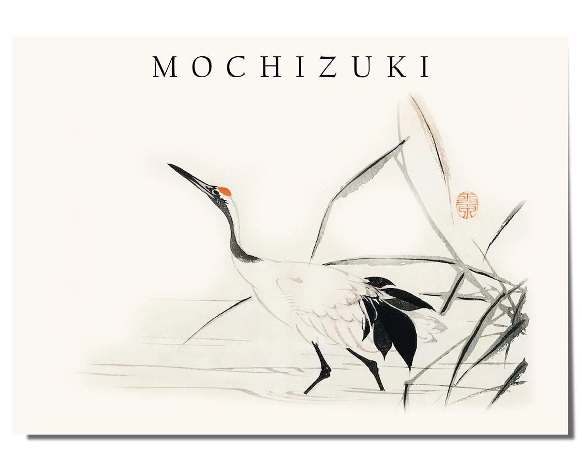 A Japanese ink painting featuring a crane with a white body, black tail feathers, and a red marking on its head, walking alongside delicate reeds. The background is soft and minimal, with subtle brushstrokes creating a peaceful and flowing composition. The artwork includes a red seal and the word "Mochizuki" written in a simple, elegant font at the top, enhancing the traditional aesthetic.
