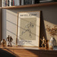 Framed print of a basketball player on a shelf with decorative items