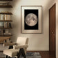 This framed full moon print brings a sense of calm and wonder to a cozy reading nook. The warm tones of the room’s decor contrast beautifully with the stark black background of the moon poster, creating a harmonious balance between modern design and natural elements. This Full Moon Art-Print is perfect for those seeking to add a piece of the universe to their home while maintaining a refined and stylish ambiance. Ideal for a variety of spaces, from a hallway to a home office, this Poster makes for an excell