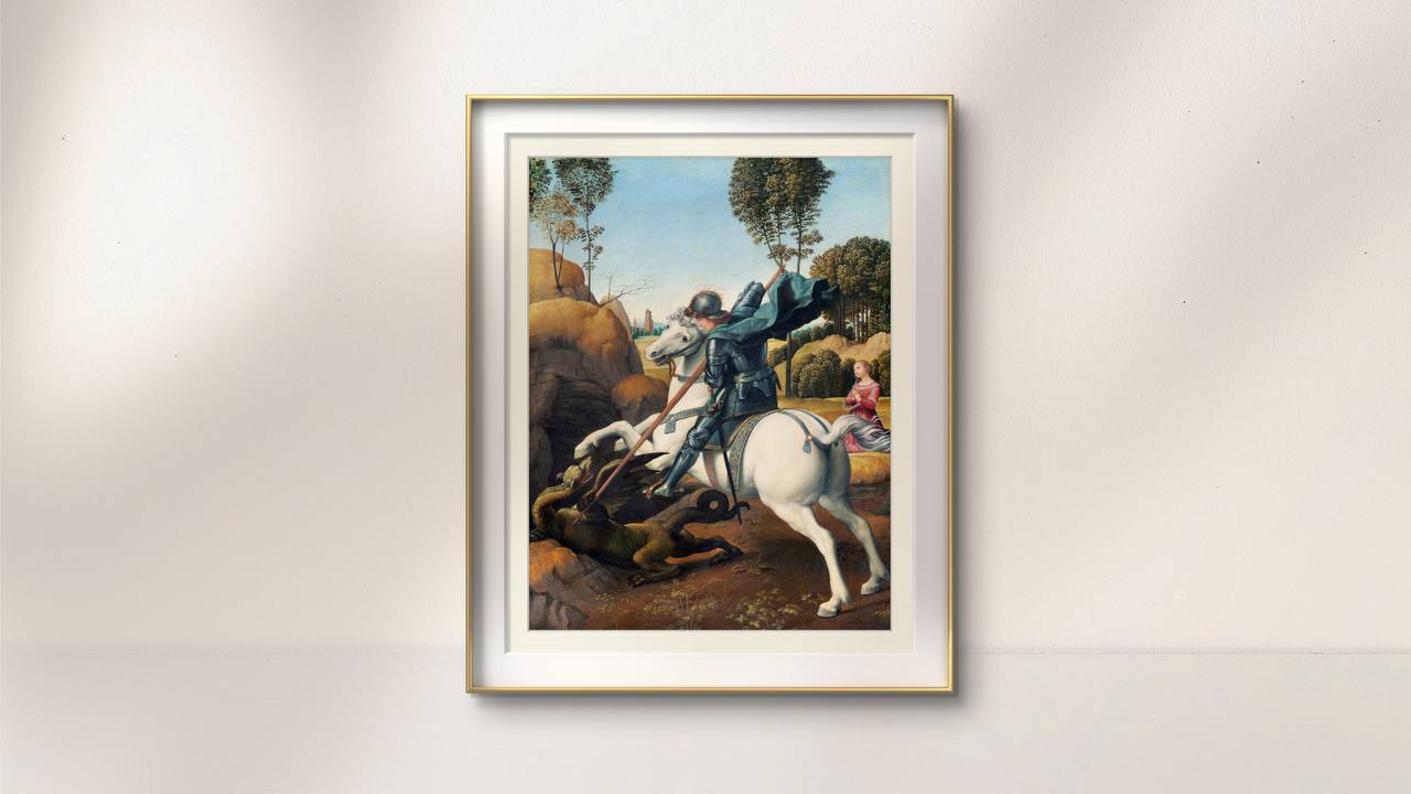 The second image shows the same "Saint George and the Dragon" poster framed in a gold-edged frame and hung on a white wall. The detailed depiction of Saint George in battle, combined with the serene landscape, adds a touch of historical drama and elegance to the room. The high-quality reproduction captures Raphael's masterful use of color and composition.