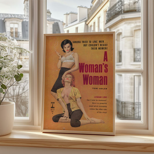 The vintage cover titled "A Woman's Woman" by Toni Adler features bold, eye-catching colors and graphics. It shows two women in a provocative pose: one woman with short black hair, wearing a sheer top and holding a cigarette, stands confidently. The other woman, with vibrant red hair, is seated and dressed in a revealing yellow top, leaning slightly as she gazes at the standing woman.