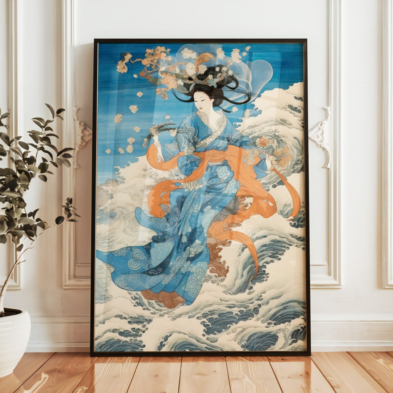 This poster features an Asian-style female figure, possibly a goddess or spirit, set against a seascape. She wears a blue kimono with intricate patterns, surrounded by orange ribbons flowing around her, giving her an ethereal and mystical appearance. Her dark hair is loose and flowing, while light-colored flowers seem to drift around her, as if floating in the air.