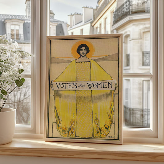 The image showcases a framed Art Nouveau-style poster promoting the women’s suffrage movement with the phrase ;Votes for Woment; at its center