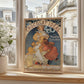 The image features a framed vintage French advertisement poster for 'Chocolat Idéal en Poudre Soluble' (Ideal Chocolate in Soluble Powder), displayed against a bright windowsill in a contemporary Parisian apartment.