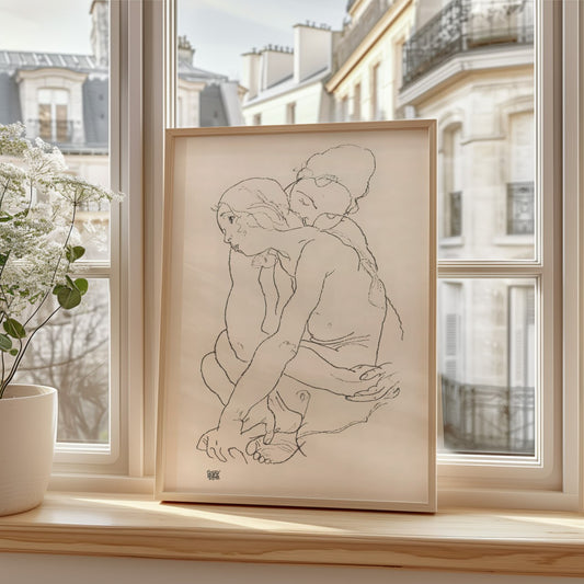 The image shows a framed artwork placed on a wooden windowsill, softly illuminated by natural light streaming through the window. The artwork appears to be a delicate line drawing, done in the expressive and minimalist style typical of Egon Schiele