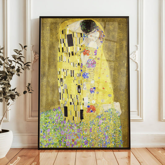 The image shows a framed reproduction of 'The Kiss' by Gustav Klimt, resting on a wooden windowsill with soft natural light streaming through the window