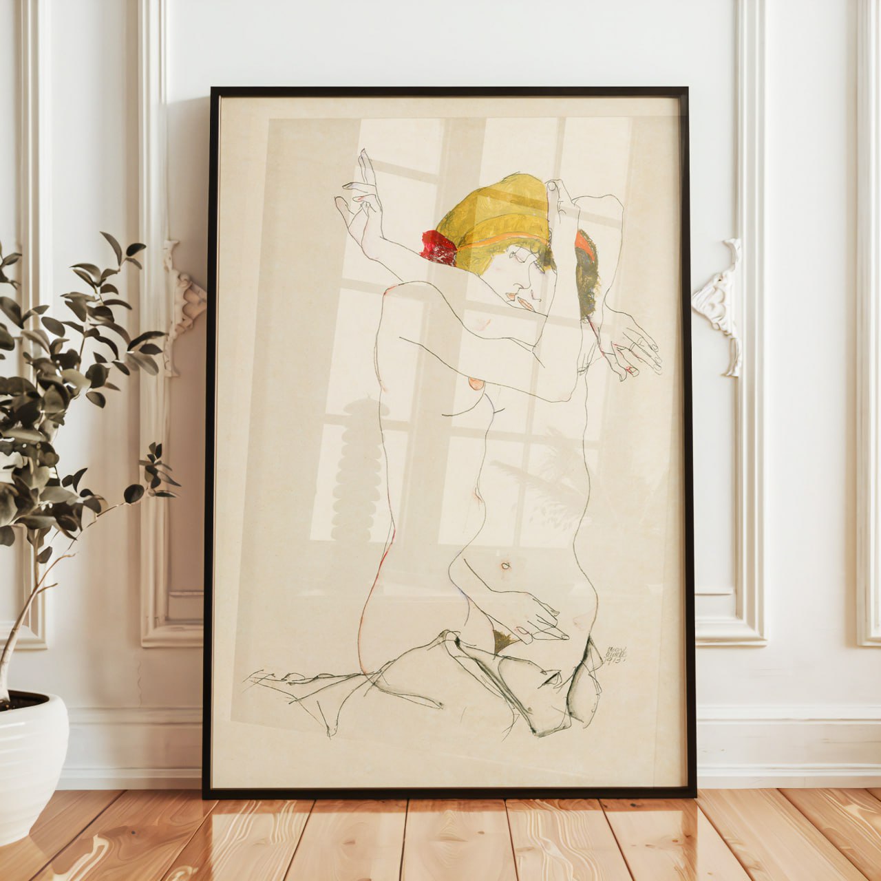 The image shows a framed artwork resting on a wooden windowsill, similar to the previous scenes. The artwork appears to be a drawing in the style of Egon Schiele, known for his expressive and raw depictions of the human figure