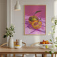 Dining room with a colorful abstract artwork of a disco ball apple on the wall.