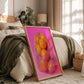 Framed artwork of oranges on a bed in a bedroom