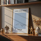 Framed artwork titled 'Stroke After Stroke' on a wooden shelf with decorative items.