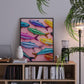 Colorful fish artwork on a shelf with books and decor items