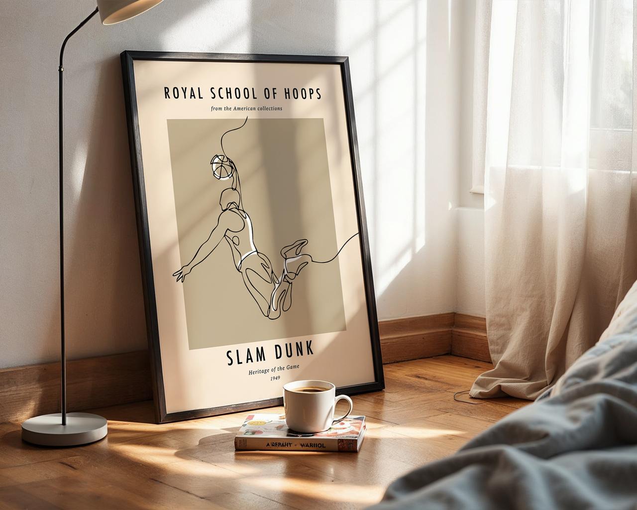 Framed poster titled 'Royal School of Hoops' on a wall with a cup and book on a surface below.
